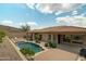Stunning backyard featuring a sparkling pool, ample patio space, and views of the surrounding desert landscape at 2722 W Hiddenview Dr, Phoenix, AZ 85045