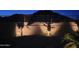 Charming backyard featuring wall with spotlighted palm trees that creates an inviting outdoor retreat at 2722 W Hiddenview Dr, Phoenix, AZ 85045