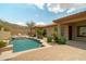 Beautiful backyard with pool, patio, and landscaping, ideal for relaxing and enjoying the desert lifestyle at 2722 W Hiddenview Dr, Phoenix, AZ 85045