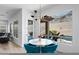 Bright breakfast nook featuring backyard views, a modern light fixture, and stylish blue chairs at 2722 W Hiddenview Dr, Phoenix, AZ 85045