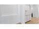 Bright hallway with cabinets, light countertops, and wood-look floors at 2722 W Hiddenview Dr, Phoenix, AZ 85045