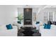 Bright living room featuring modern seating, a stylish fireplace, and an open floorplan at 2722 W Hiddenview Dr, Phoenix, AZ 85045