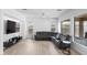 Spacious living room features natural light, recessed lighting, and a plush gray sectional sofa at 2722 W Hiddenview Dr, Phoenix, AZ 85045