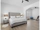 Main bedroom featuring a king bed, a large TV, and natural lighting for a serene ambiance at 2722 W Hiddenview Dr, Phoenix, AZ 85045