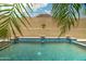 Inviting pool area featuring tile accents and desert landscaping for a serene, private backyard oasis at 2722 W Hiddenview Dr, Phoenix, AZ 85045