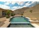 Serene pool with stone accents, water features, and mountain views at 2722 W Hiddenview Dr, Phoenix, AZ 85045