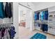 Large walk-in closet with custom organizers and a cozy seating bench at 2722 W Hiddenview Dr, Phoenix, AZ 85045