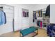 Spacious walk-in closet boasts custom shelving, cabinets, drawers, and a comfortable bench at 2722 W Hiddenview Dr, Phoenix, AZ 85045
