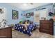 Bedroom with playful decor, a ceiling fan, and ample storage space for a comfortable living at 2813 N 107Th Dr, Avondale, AZ 85392