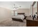 Spacious main bedroom featuring a vaulted ceiling, ceiling fan, and neutral decor at 2813 N 107Th Dr, Avondale, AZ 85392