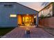 Charming back patio features a fire pit, covered seating area, and sliding glass doors at 29819 W Whitton Ave, Buckeye, AZ 85396