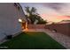 Private backyard featuring low-maintenance turf, a paver patio, and a decorative gravel area, ideal for outdoor enjoyment at 29819 W Whitton Ave, Buckeye, AZ 85396