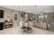 Cozy dining area featuring a round table with four chairs, neutral colors, and open access to the living room at 29819 W Whitton Ave, Buckeye, AZ 85396