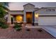 Lovely one-story home with desert landscaping, covered porch, and a two-car garage at 29819 W Whitton Ave, Buckeye, AZ 85396