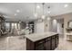 Open kitchen concept, with granite countertops, dining area, and living room at 29819 W Whitton Ave, Buckeye, AZ 85396