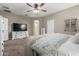Serene main bedroom featuring neutral tones, a walk-in closet, and an en-suite bathroom at 29819 W Whitton Ave, Buckeye, AZ 85396