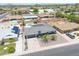 Aerial view of a home with a private pool, desert landscaping, and a gray shingle roof at 310 E Fremont Dr, Tempe, AZ 85282