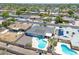 An aerial view showcases a private backyard, mature landscaping, and a refreshing swimming pool at 310 E Fremont Dr, Tempe, AZ 85282