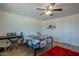 Bedroom with wood floors, queen bed, decorative string lights, and musical keyboard at 310 E Fremont Dr, Tempe, AZ 85282