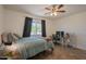 Bedroom with wood floors, window with curtains and a modern desk setup at 310 E Fremont Dr, Tempe, AZ 85282