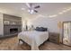 Inviting bedroom with a brick fireplace, wood floors, and soft lighting, perfect for relaxation at 310 E Fremont Dr, Tempe, AZ 85282