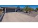 A charming single-story home with a desert-style front yard and an attached two-car garage at 310 E Fremont Dr, Tempe, AZ 85282