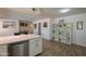 Open-concept living area with dining and kitchen, featuring tile flooring and stylish decor at 310 E Fremont Dr, Tempe, AZ 85282