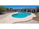 Backyard showcasing a sparkling private pool with expansive patio area and desert landscaping at 310 E Fremont Dr, Tempe, AZ 85282