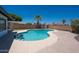 Backyard pool area featuring an in-ground pool with desert landscaping and block fencing at 310 E Fremont Dr, Tempe, AZ 85282