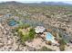 An aerial view of the community clubhouse, pool, tennis courts, and desert landscape nestled in a scenic area at 31107 N 72Nd Pl, Scottsdale, AZ 85266