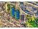 Aerial view of tennis and basketball courts, parking, and desert landscaping in a community at 31107 N 72Nd Pl, Scottsdale, AZ 85266
