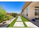 Landscaped backyard featuring pavers and artificial turf at 31107 N 72Nd Pl, Scottsdale, AZ 85266