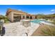 Beautiful backyard oasis featuring a pool, spa, outdoor kitchen, and fire pit at 31107 N 72Nd Pl, Scottsdale, AZ 85266