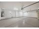 Spacious garage with epoxy floors, lighting, and garage door openers at 31107 N 72Nd Pl, Scottsdale, AZ 85266