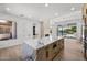 Spacious kitchen with a large marble island, modern appliances, and a view of the pool and backyard at 31107 N 72Nd Pl, Scottsdale, AZ 85266