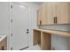 Clean laundry room with countertop and wood cabinetry at 31107 N 72Nd Pl, Scottsdale, AZ 85266