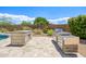 Outdoor kitchen featuring a built-in grill, and stone counter at 31107 N 72Nd Pl, Scottsdale, AZ 85266