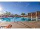 Expansive swimming pool surrounded by comfortable lounge chairs and shaded seating areas at 31107 N 72Nd Pl, Scottsdale, AZ 85266