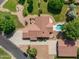 Aerial view of a home featuring a pool, detached garage, and mature landscaping at 3357 N Ashbrook E St, Mesa, AZ 85213