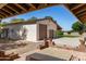 A detached garage with two car bays featuring desert landscaping and brick trimmed hot tub at 3357 N Ashbrook E St, Mesa, AZ 85213