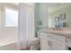Fresh bathroom featuring a bathtub with shower, vanity, and framed mirror at 3619 E Thornton Ave, Gilbert, AZ 85297