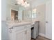 Bright bathroom featuring a large vanity, a mirrored wall, and a dedicated seating area at 3619 E Thornton Ave, Gilbert, AZ 85297