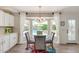 Cozy breakfast nook with a pool view, chandelier, and custom window treatments at 3619 E Thornton Ave, Gilbert, AZ 85297
