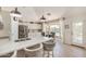 Modern kitchen with a breakfast bar, stainless steel appliances, and an adjoining breakfast nook at 3619 E Thornton Ave, Gilbert, AZ 85297