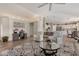 Bright living area with open flow to the kitchen, featuring a desk area and comfortable seating at 3619 E Thornton Ave, Gilbert, AZ 85297