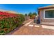 Neat side yard with gravel landscaping, stepping stones, and blooming bougainvillea, offering easy maintenance at 3619 E Thornton Ave, Gilbert, AZ 85297
