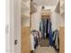 Well-organized walk-in closet with ample shelving and hanging space for clothing at 3619 E Thornton Ave, Gilbert, AZ 85297