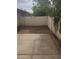 Spacious backyard featuring a large concrete patio, neutral fencing, and mature trees at 3807 W Mitchell Dr, Phoenix, AZ 85019