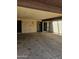 Large carport with a doorway and sliding glass doors, perfect for storage or parking at 3807 W Mitchell Dr, Phoenix, AZ 85019