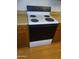 Kitchen featuring wood cabinets, laminate wood floors and appliances at 3807 W Mitchell Dr, Phoenix, AZ 85019